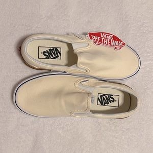 Cream slip on vans